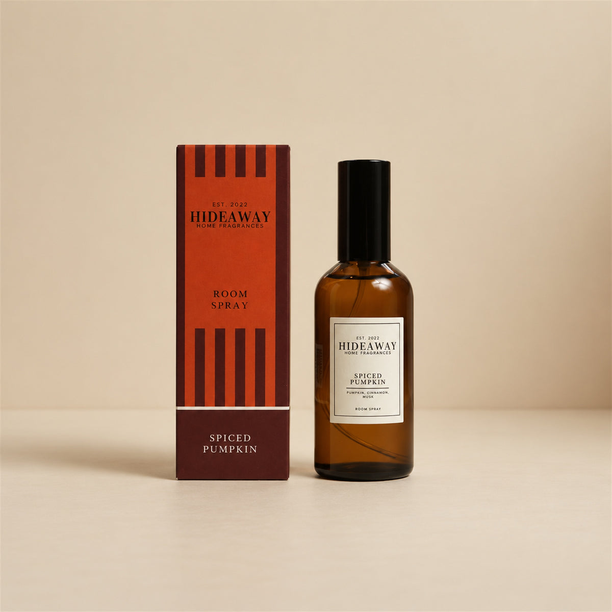 Hideaway Home Fragrances spiced pumpkin room spray bottle centered against a clean, minimalist studio background.