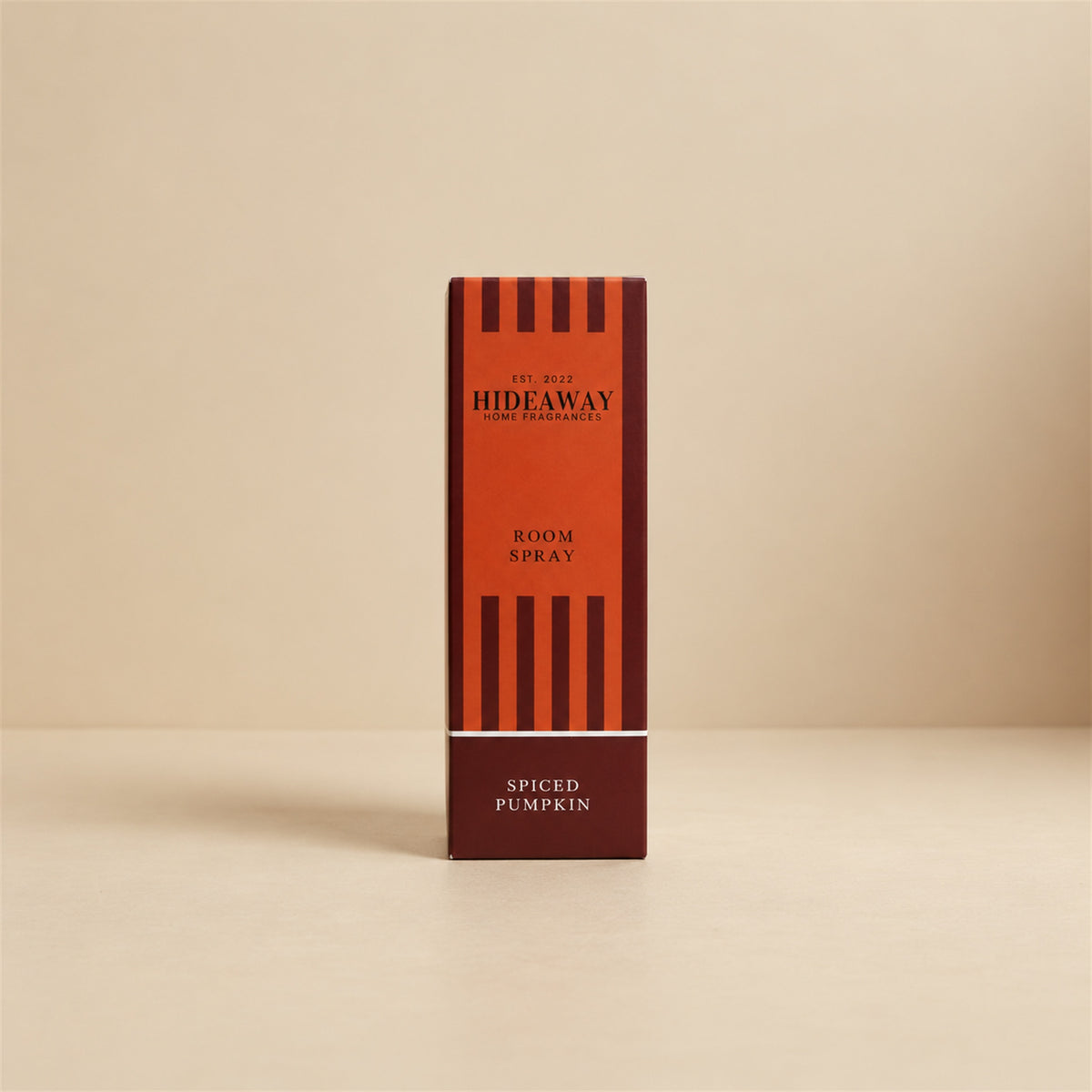 Luxury packaged gift box and matching bottle for Hideaway Home Fragrances spiced pumpkin room spray highlighting cosy autumn and musk home fragrance notes.