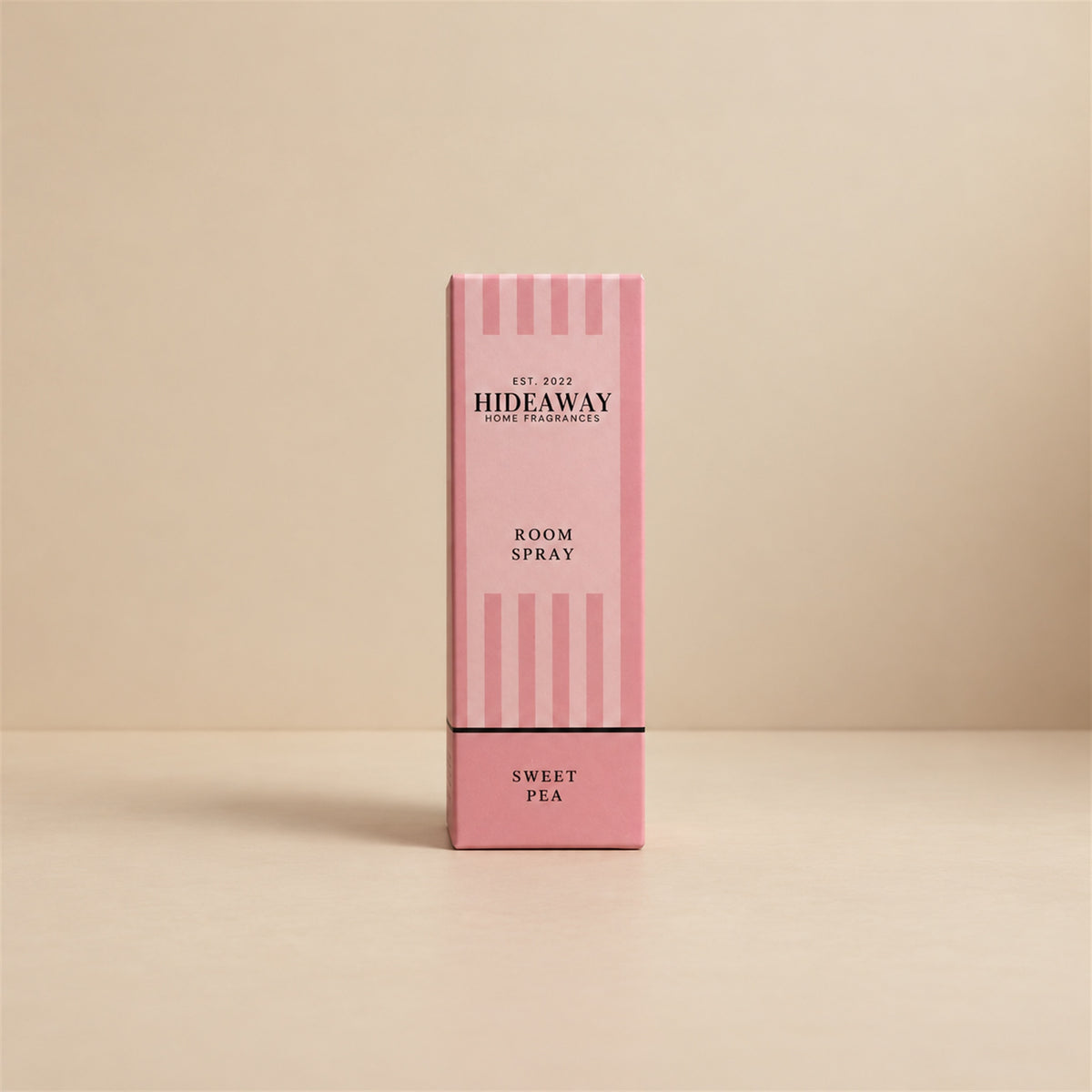 Luxury packaged gift box and matching glass bottle for Hideaway Home Fragrances sweet pea room spray highlighting floral and woody home fragrance notes.