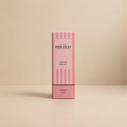 Luxury packaged gift box and matching glass bottle for Hideaway Home Fragrances sweet pea room spray highlighting floral and woody home fragrance notes.