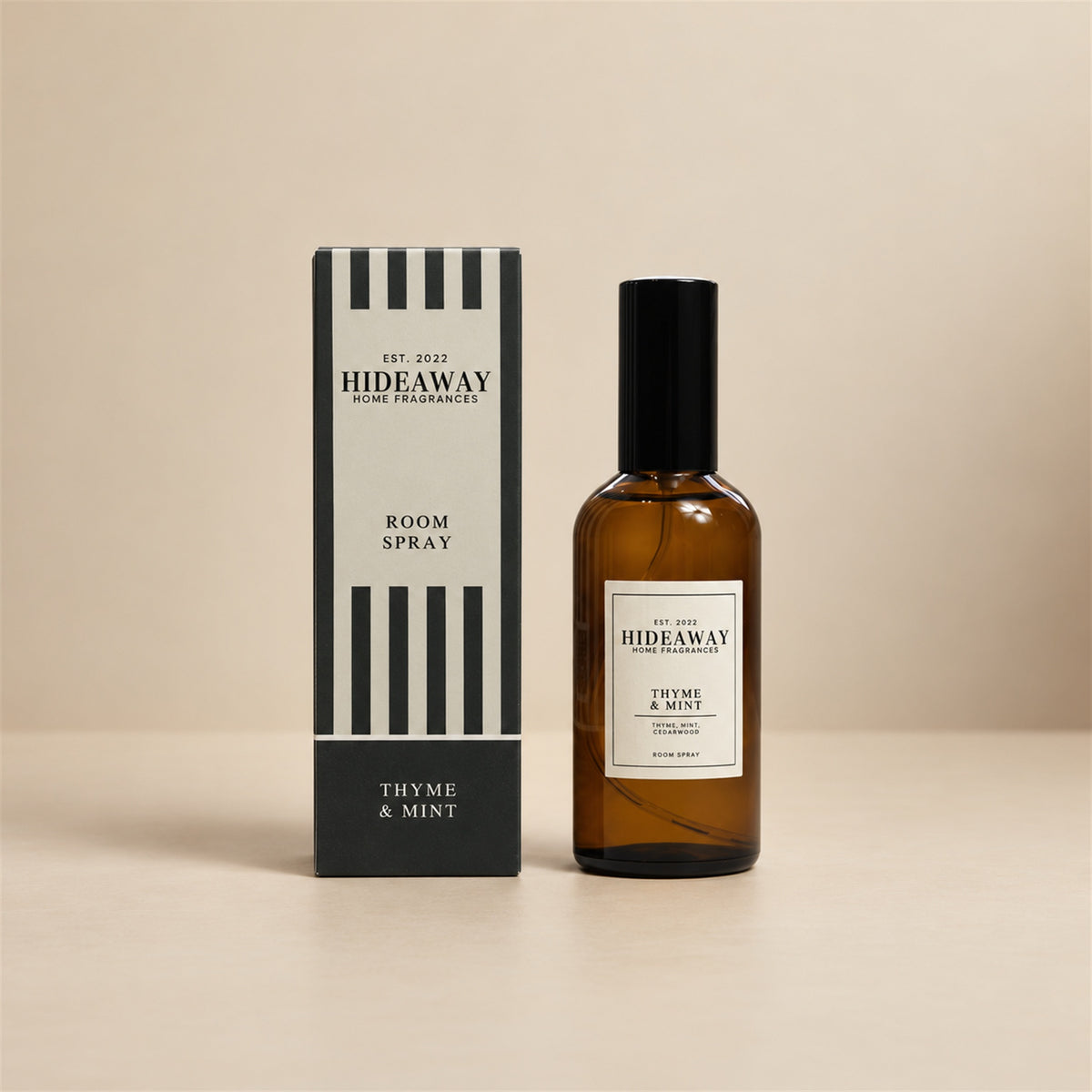 Hideaway Home Fragrances thyme and mint room spray bottle standing against a bright, neutral studio background.