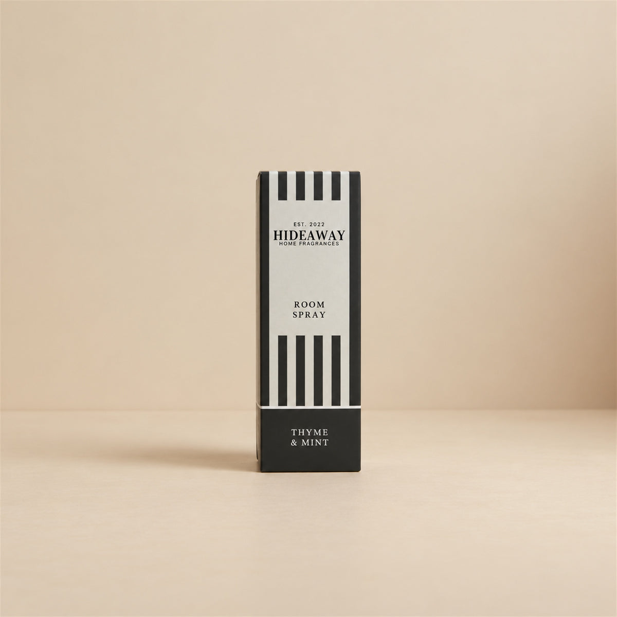 Packaged Hideaway Home Fragrances thyme and mint room spray bottle beside its luxury retail gift box highlighting herbal and citrus petitgrain notes.