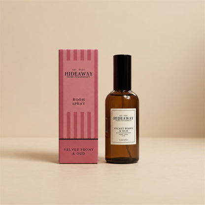 Hideaway Home Fragrances velvet peony and oud room spray bottle centered against a minimalist studio background.