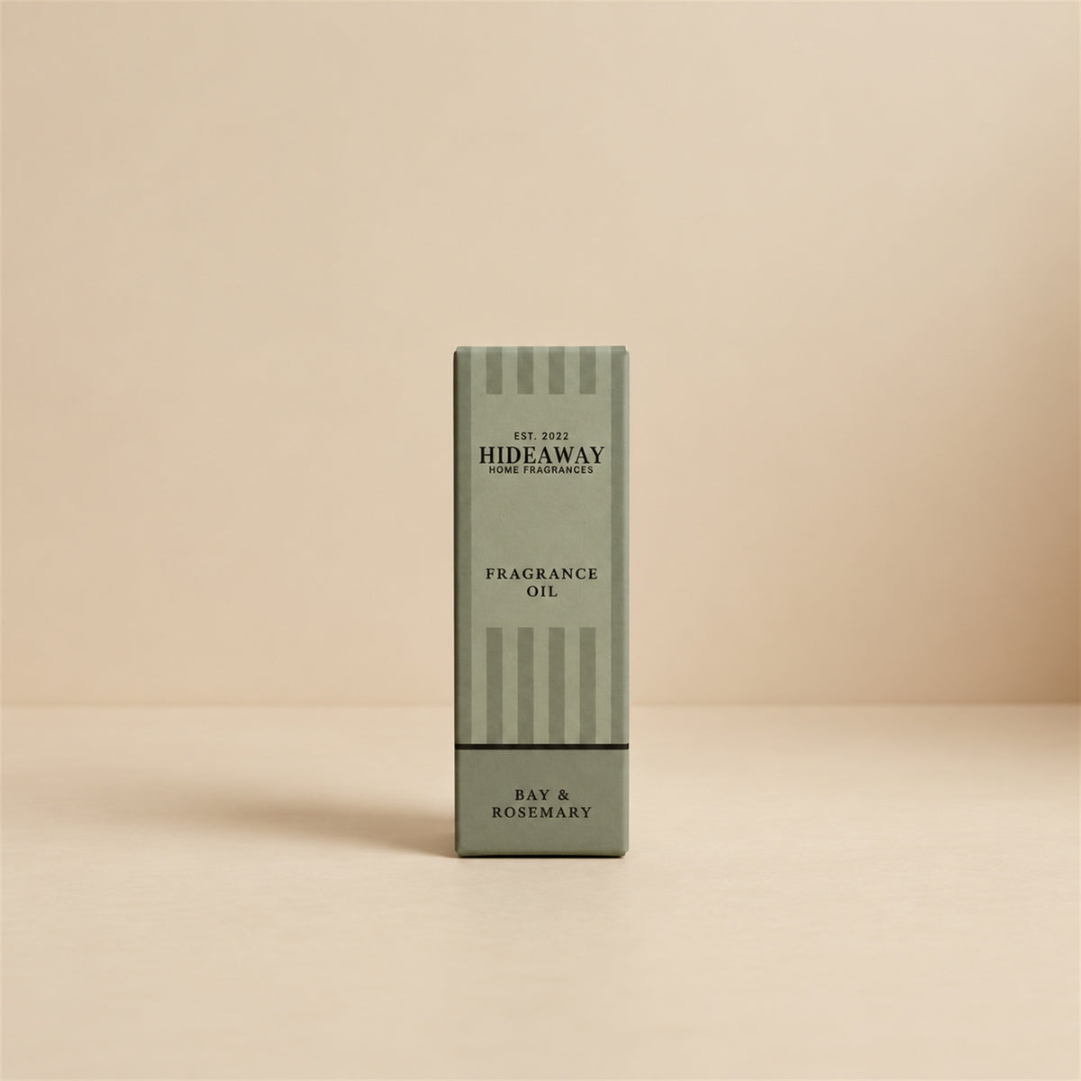 Packaged Hideaway Home Fragrances bay and rosemary fragrance oil bottle shown with its luxury retail box highlighting woody pine and musk base notes.