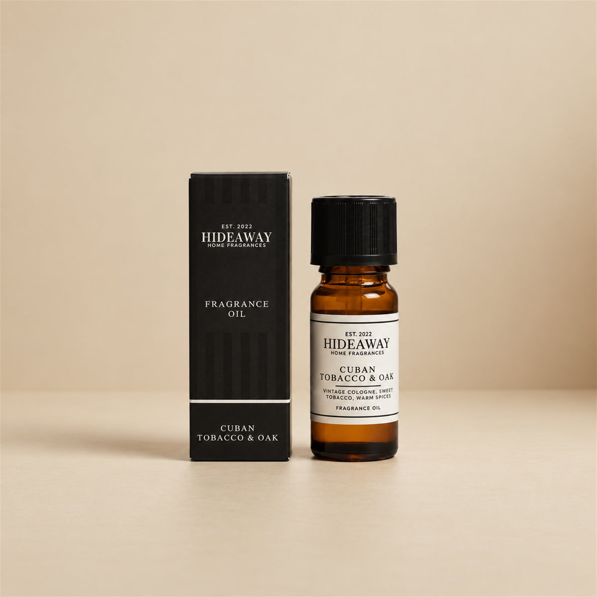 Hideaway Home Fragrances cuban tobacco and oak fragrance oil bottle standing against a neutral studio background.