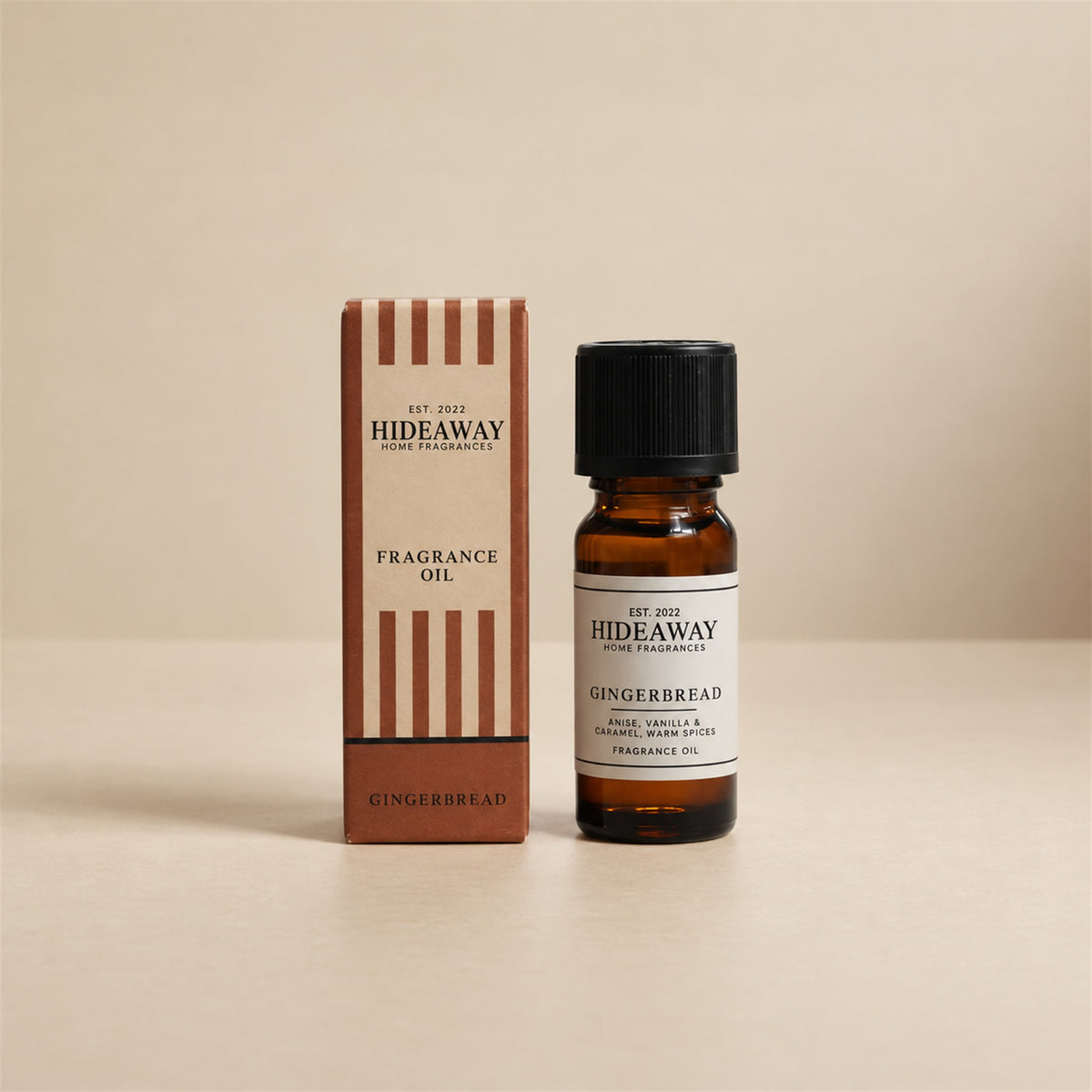 Hideaway Home Fragrances gingerbread fragrance oil bottle standing against a seamless neutral studio backdrop.