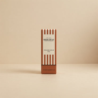 Packaged Hideaway Home Fragrances gingerbread fragrance oil bottle standing beside its luxury retail box highlighting homemade gingerbread and sweet maple syrup notes.