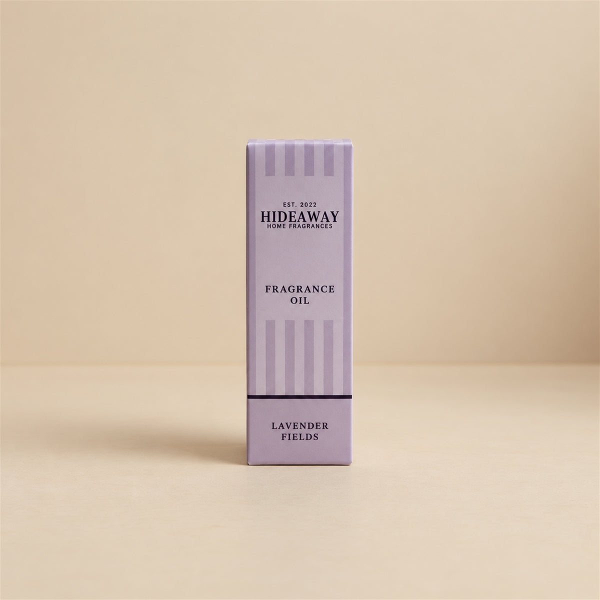 Packaged Hideaway Home Fragrances lavender fields fragrance oil bottle standing beside its luxury retail box highlighting pure calming lavender aromas.