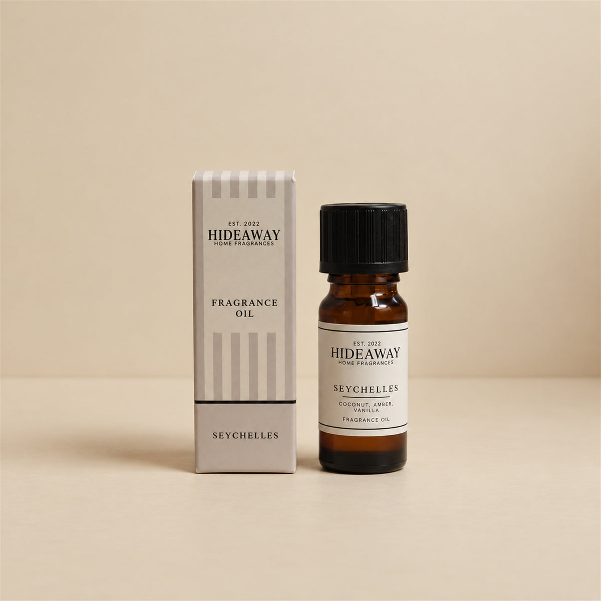 Hideaway Home Fragrances seychelles fragrance oil bottle standing against a seamless neutral studio backdrop.