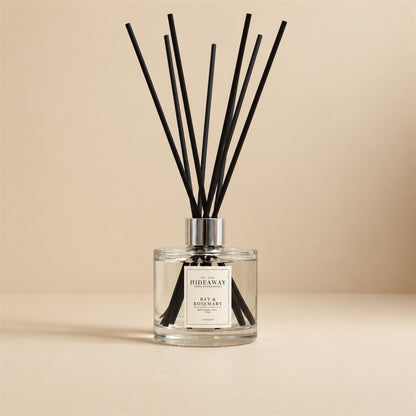 Bay and rosemary reed diffuser by Hideaway Home Fragrances featuring citrus, bay leaf, lavender, pine needle, and musk notes