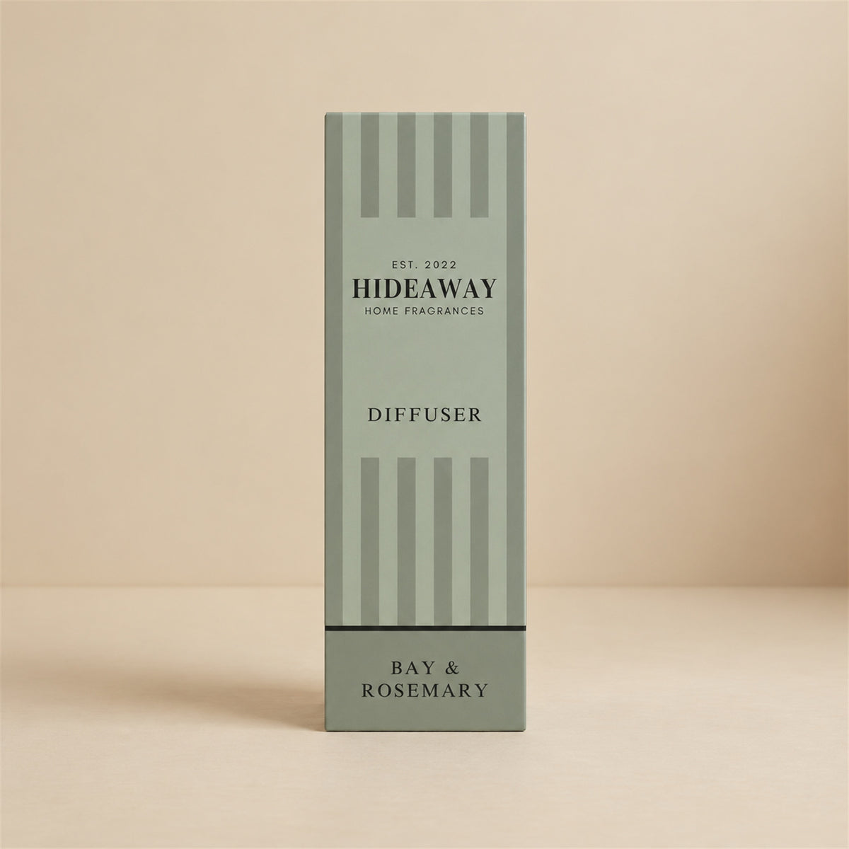 Herbal bay and rosemary reed diffuser with natural reeds on a styled shelf by Hideaway Home Fragrances