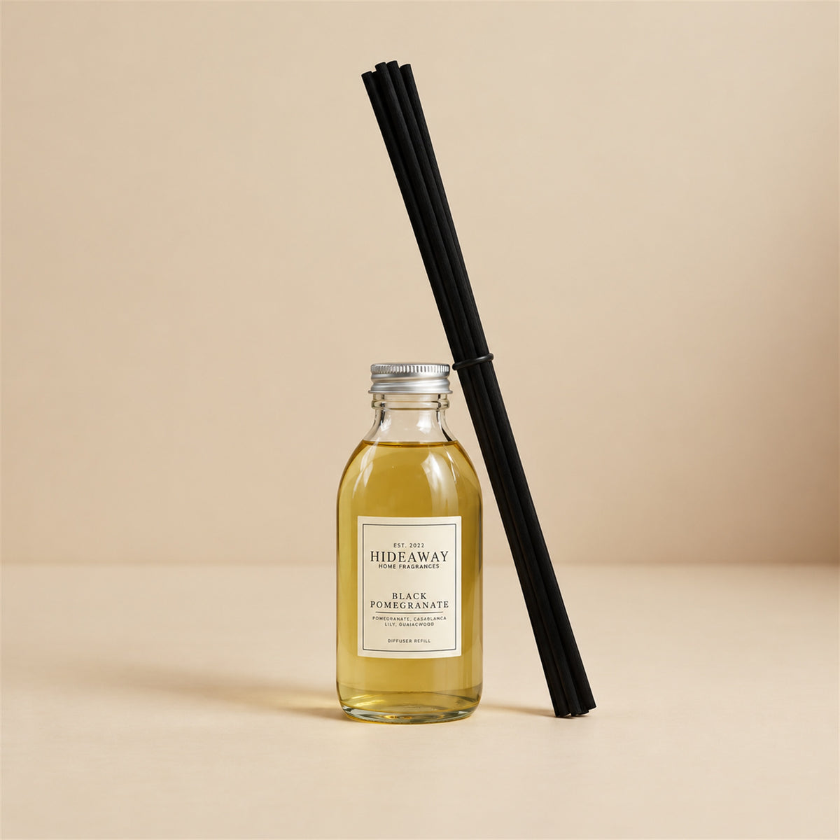 Black pomegranate and Casablanca lily diffuser oil refill by Hideaway Home Fragrances with smoky guaiac wood