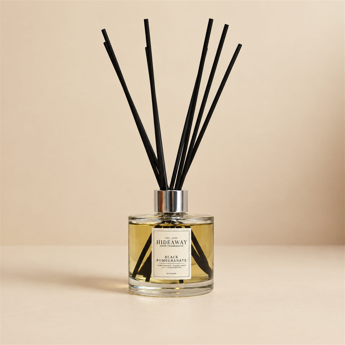 Black pomegranate and Casablanca lily diffuser oil by Hideaway Home Fragrances with smoky guaiac wood
