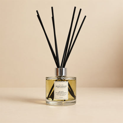 Black pomegranate and Casablanca lily diffuser oil by Hideaway Home Fragrances with smoky guaiac wood