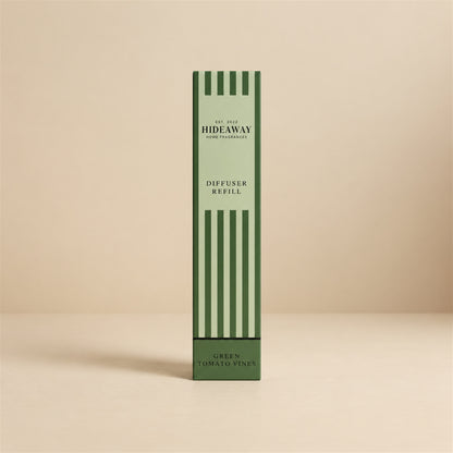 Pouring green tomato vines fragrance oil refill for a Hideaway Home Fragrances reed diffuser top-up