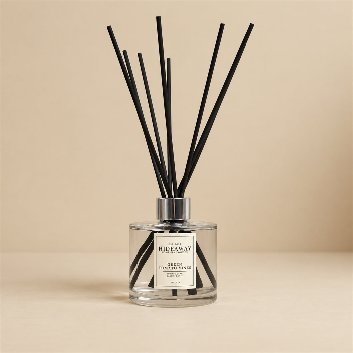Green tomato vines reed diffuser by Hideaway Home Fragrances featuring tagette, rosy heart, musk, and amber