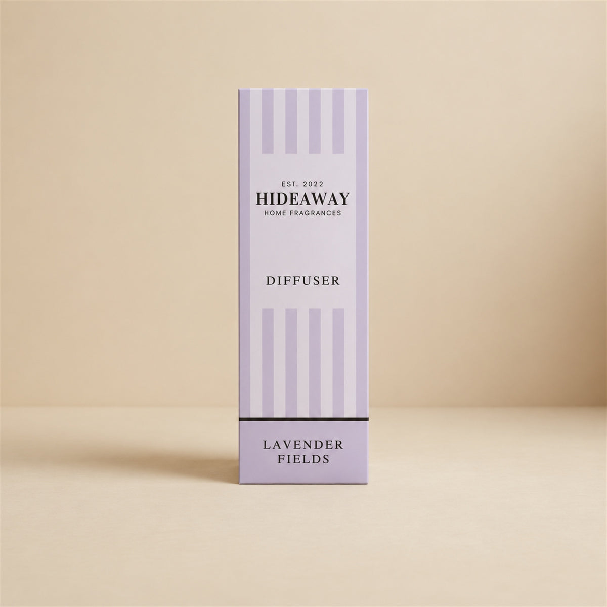 Hideaway Home Fragrances lavender fields reed diffuser with rattan reeds on a bedside table