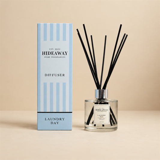 Hideaway Home Fragrances laundry reed diffuser with fresh orange, green apple, rose, and vanilla notes