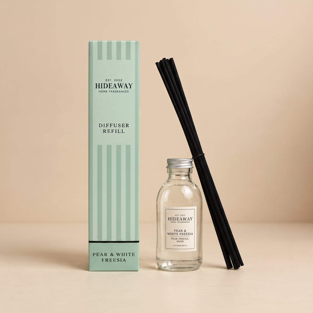 Hideaway Home Fragrances pear and white freesia reed diffuser refill bottle with pear, freesia, and amber notes