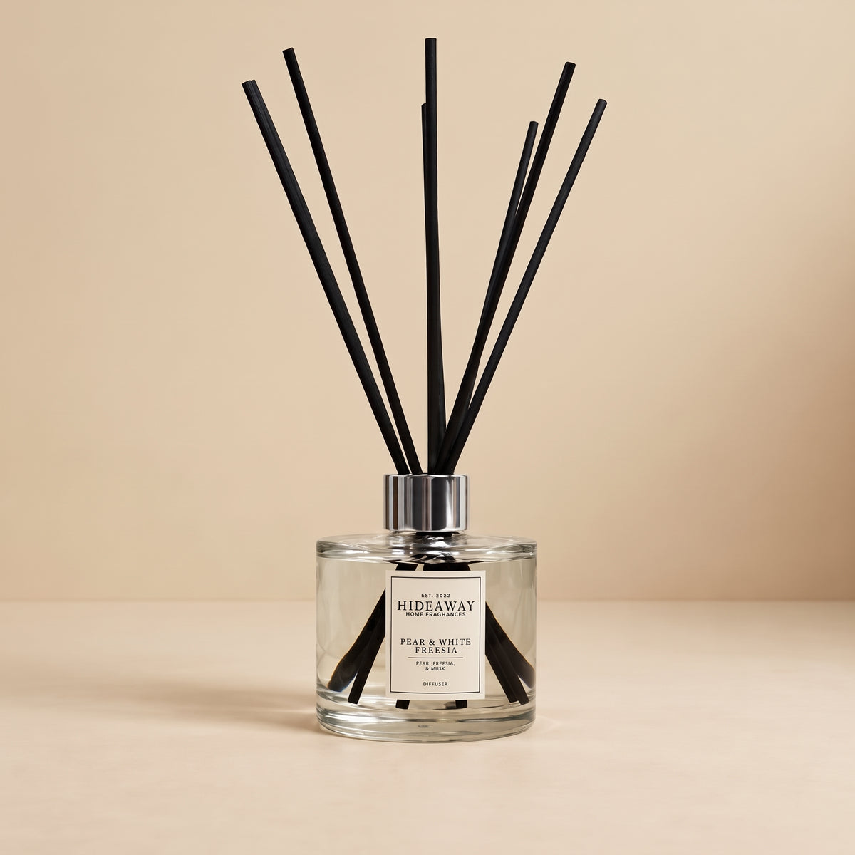 Crisp pear, tart rhubarb, and warm amber reed diffuser by Hideaway Home Fragrances with rattan reed sticks