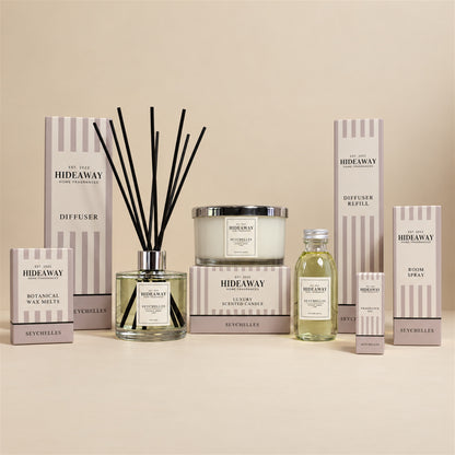 Hideaway Home Fragrances seychelles collection including diffusers, candles, wax melts, sprays, and oils