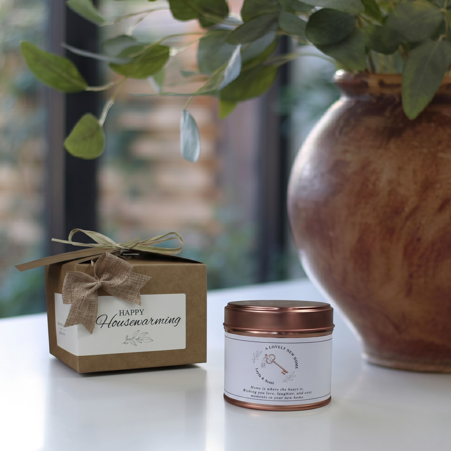 Custom first home housewarming gift box featuring a personalized house key illustration candle and matching home fragrance diffuser by Hideaway Home Fragrances.