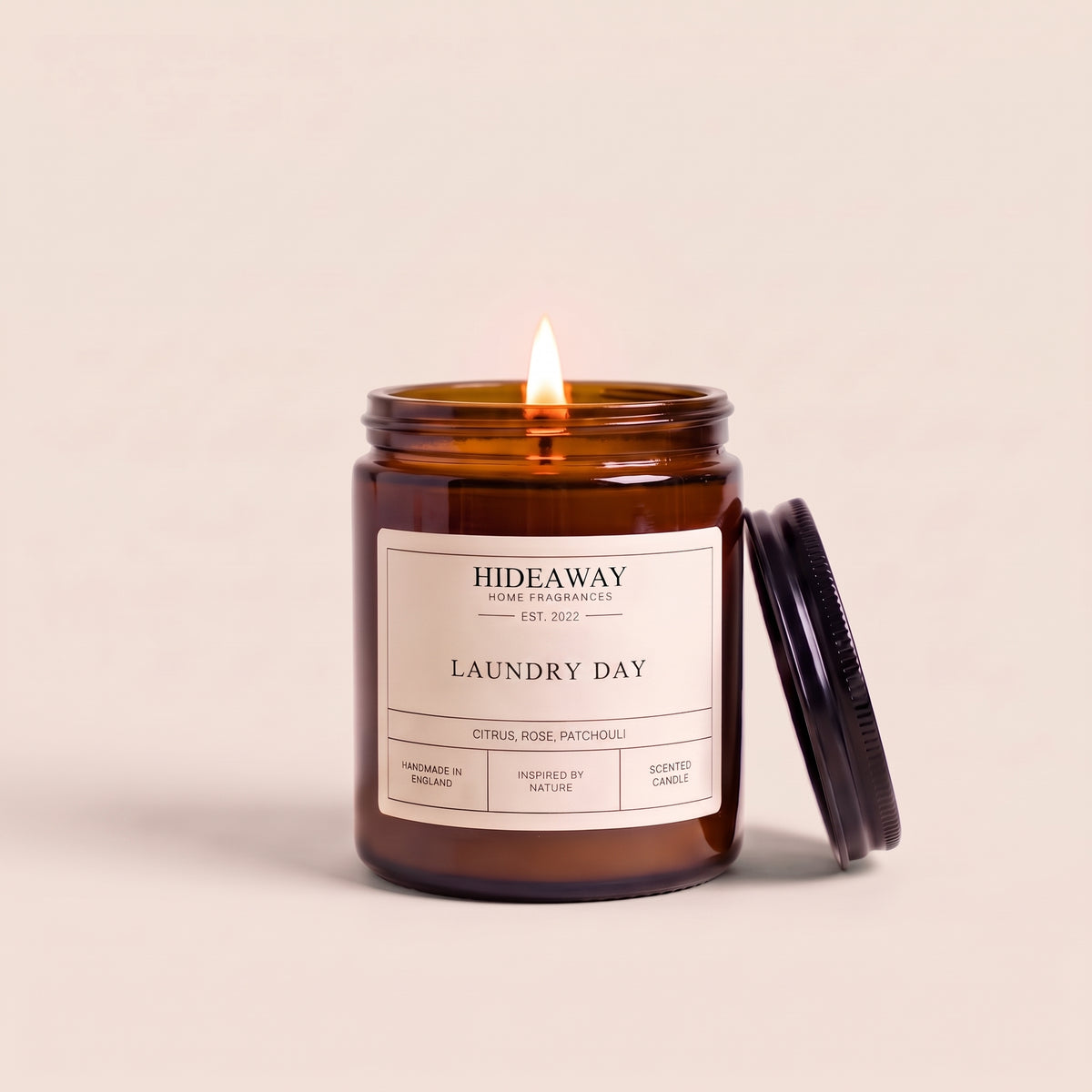 Hand-poured laundry day amber glass candle featuring airy notes of fresh cotton and clean linen, Hideaway Home Fragrances
