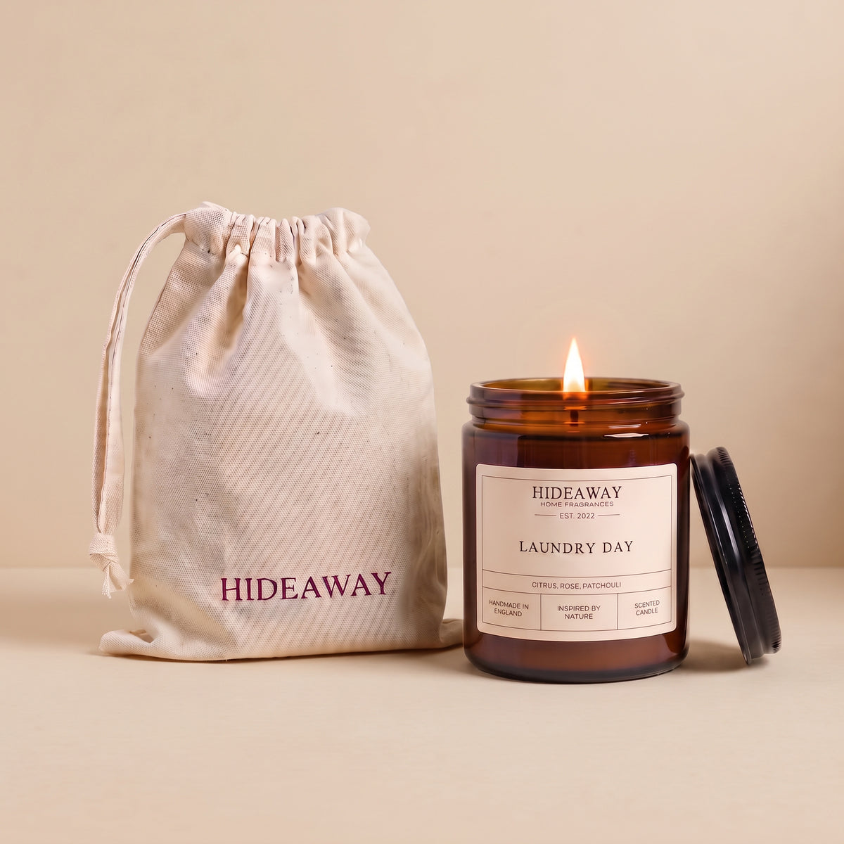 Laundry day amber glass candle with fresh clean linen scent by Hideaway Home Fragrances