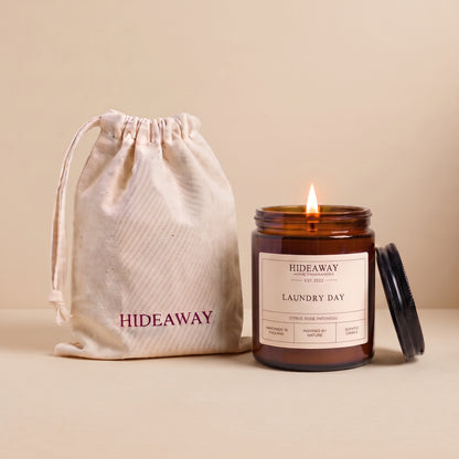 Laundry day amber glass candle with fresh clean linen scent by Hideaway Home Fragrances