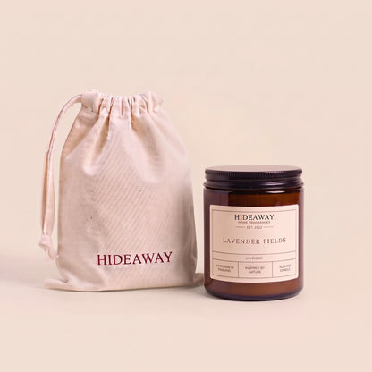 Relaxing lavender fields aromatic candle in an amber glass jar creating a tranquil sleep atmosphere from Hideaway Home Fragrances