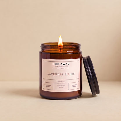 Hand-poured lavender fields amber glass candle featuring soothing notes of French lavender and soft herbal woods, Hideaway Home Fragrances