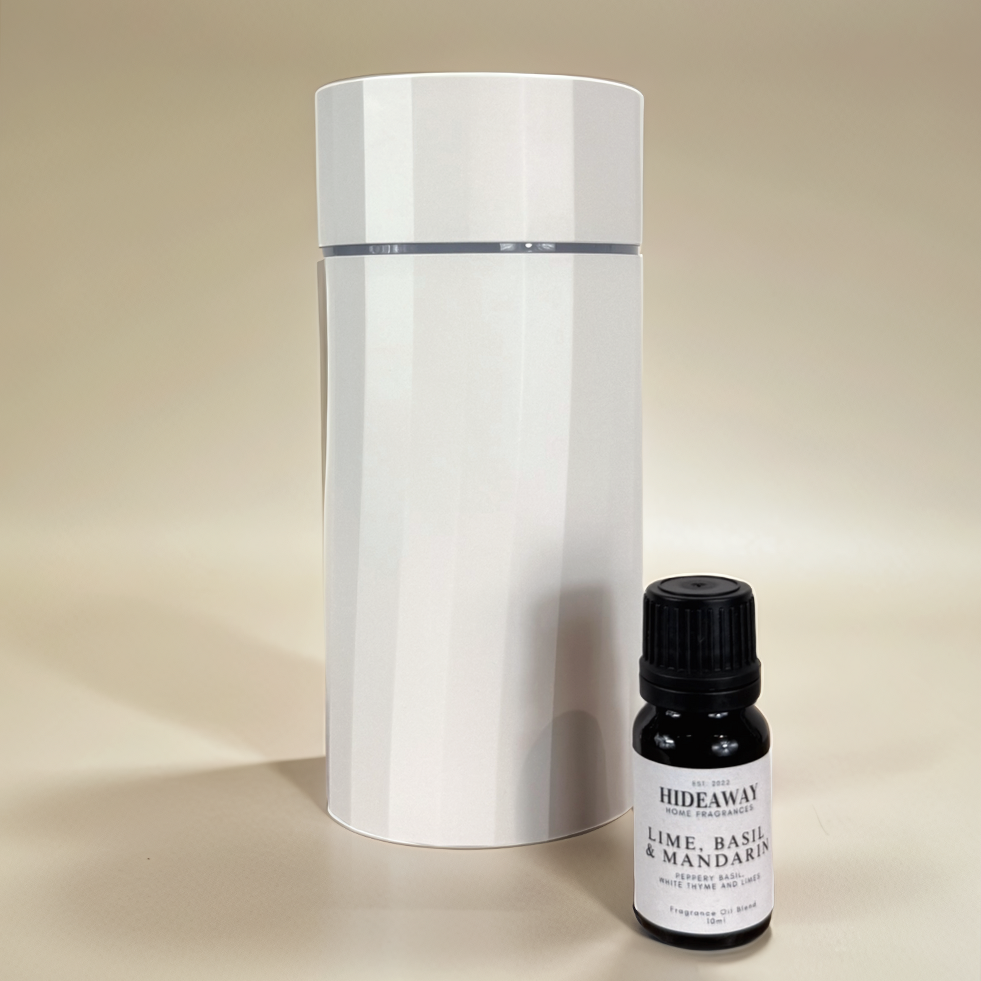 Fresh and sophisticated Lime, Basil & Mandarin fragrance oil featuring zesty lime, ripe mandarin, and warm subtle undertones – Hideaway Home Fragrances