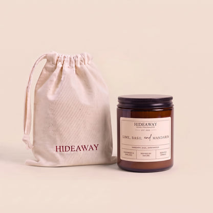 Refreshing lime, basil and mandarin aromatic candle in an amber glass jar offering an uplifting citrus aroma from Hideaway Home Fragrances