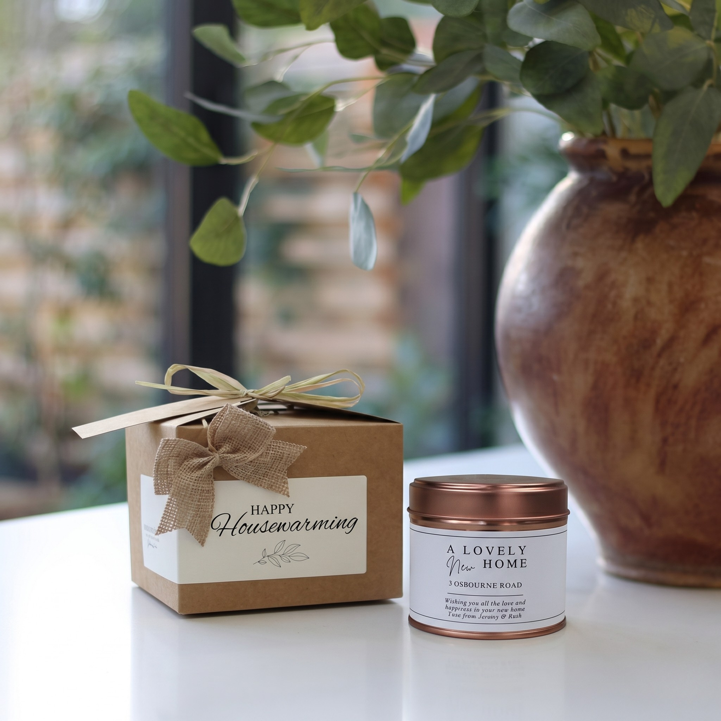 Custom housewarming gift box featuring a personalized new home address candle and matching home fragrance diffuser by Hideaway Home Fragrances.