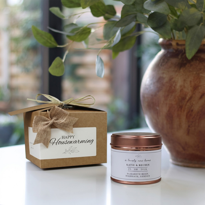 Custom housewarming care package gift box featuring a personalized new home congratulations candle and matching home fragrance diffuser by Hideaway Home Fragrances.