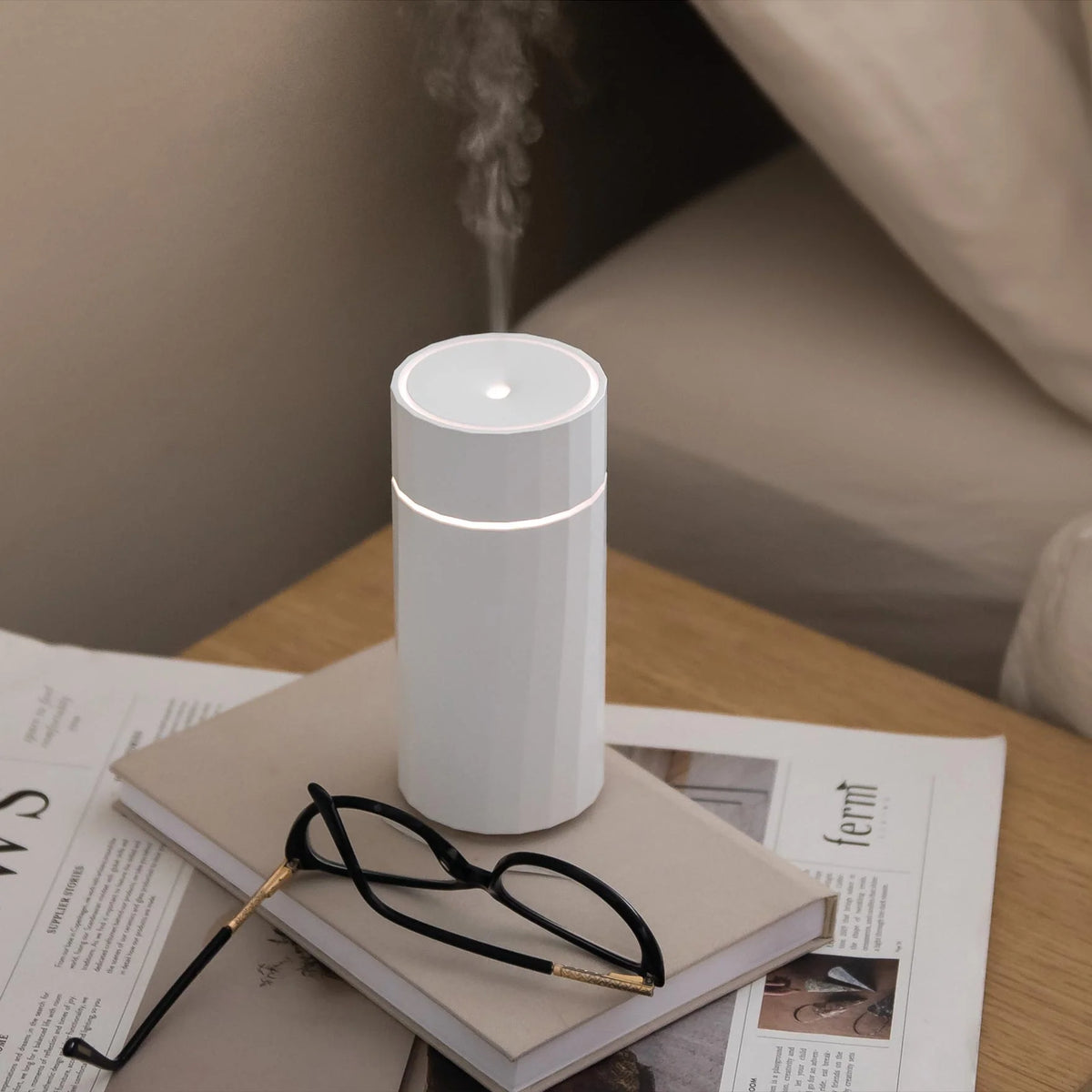 Fine cool ultrasonic mist rising from the Nomad Rechargeable Wireless Aroma Diffuser by Hideaway Home Fragrances