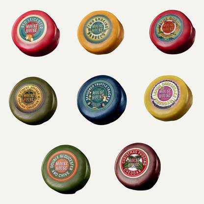 Assorted Mouse House wax-coated cheese truckles featuring traditional and contemporary flavours, expertly crafted artisan British cheese