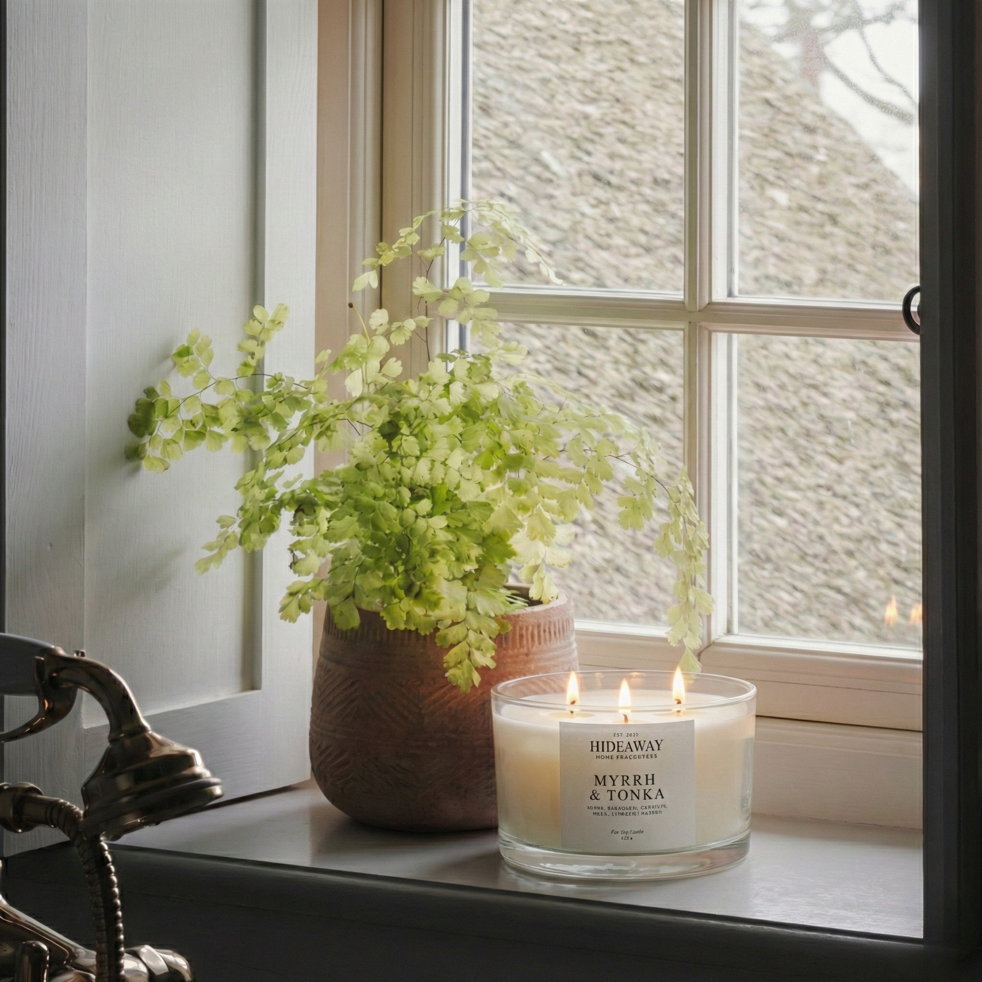 Myrrh and Tonka 3-wick luxury candle filling a living room with warm, opulent fragrance for a sensual home atmosphere