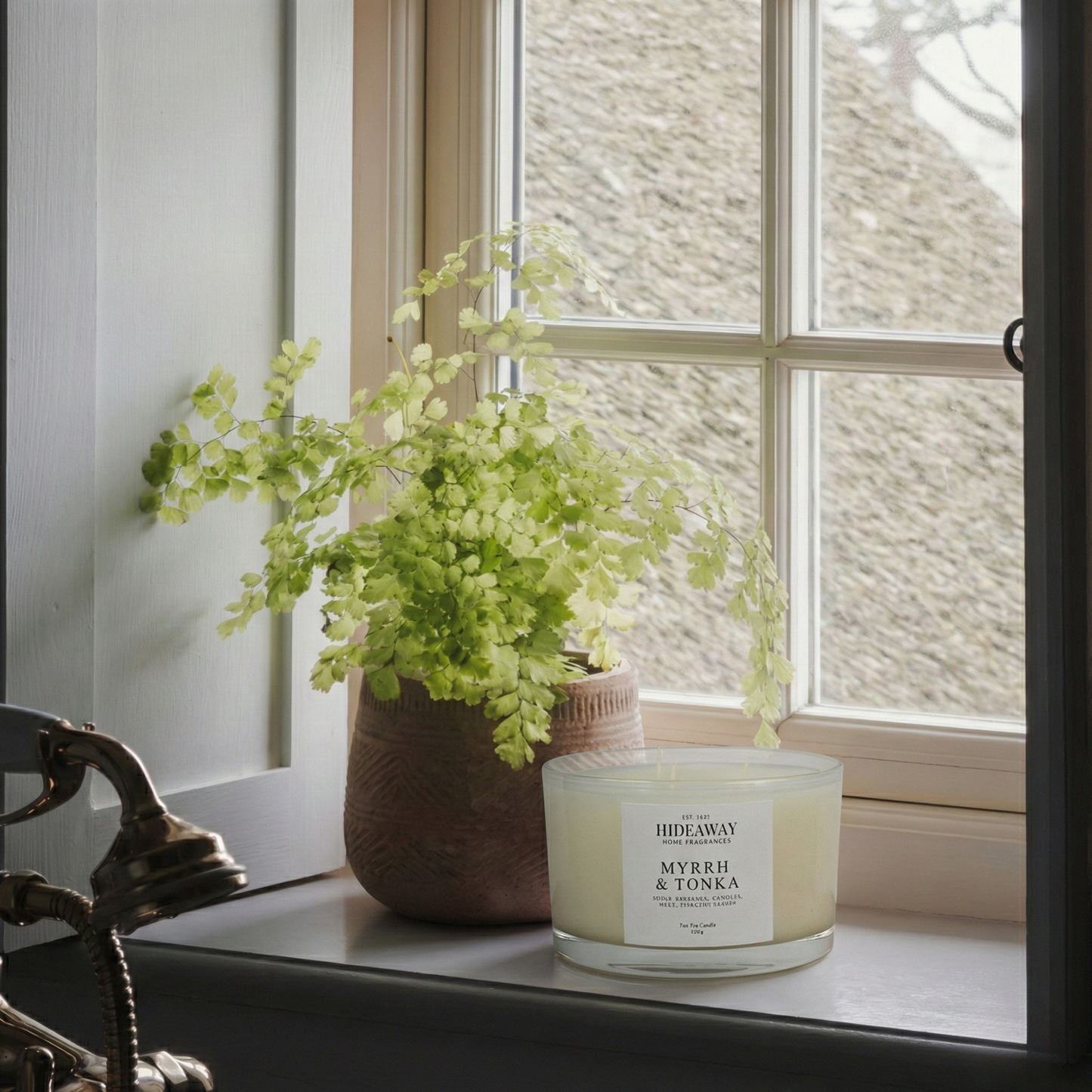 Opulent Myrrh & Tonka three-wick candle with rich resinous scent creating a velvety, inviting evening ambiance