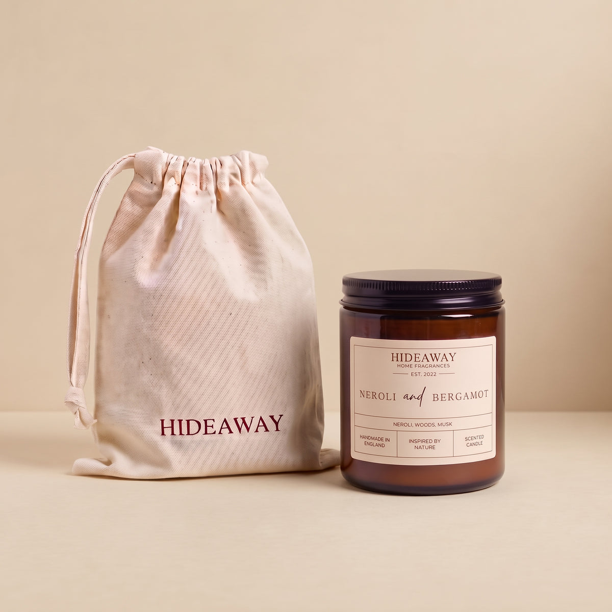 Uplifting neroli and bergamot aromatic candle in an amber glass jar creating a vibrant floral atmosphere from Hideaway Home Fragrances