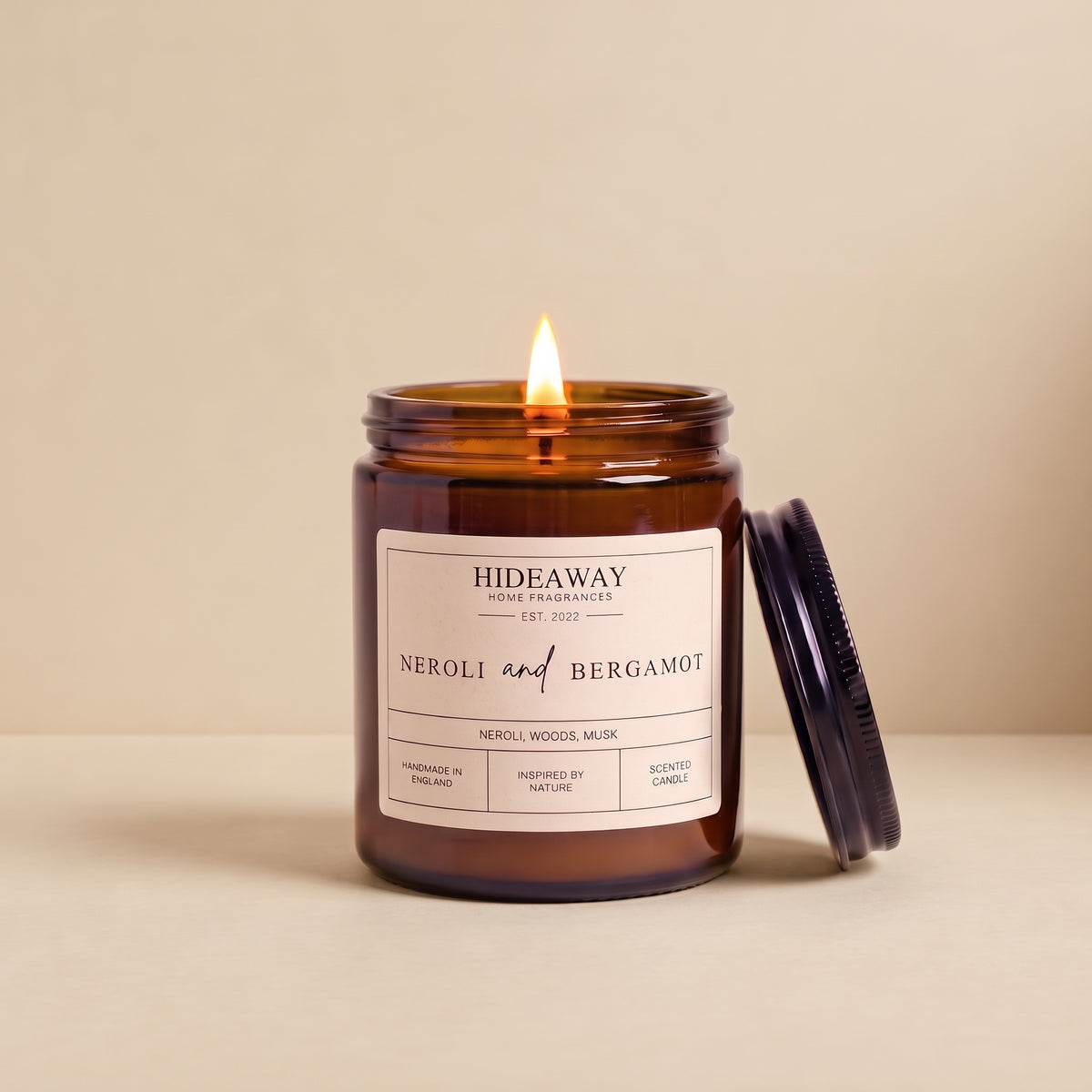 Hand-poured neroli and bergamot amber glass candle featuring notes of sweet orange blossom, bitter bergamot, and floral citrus, Hideaway Home Fragrances