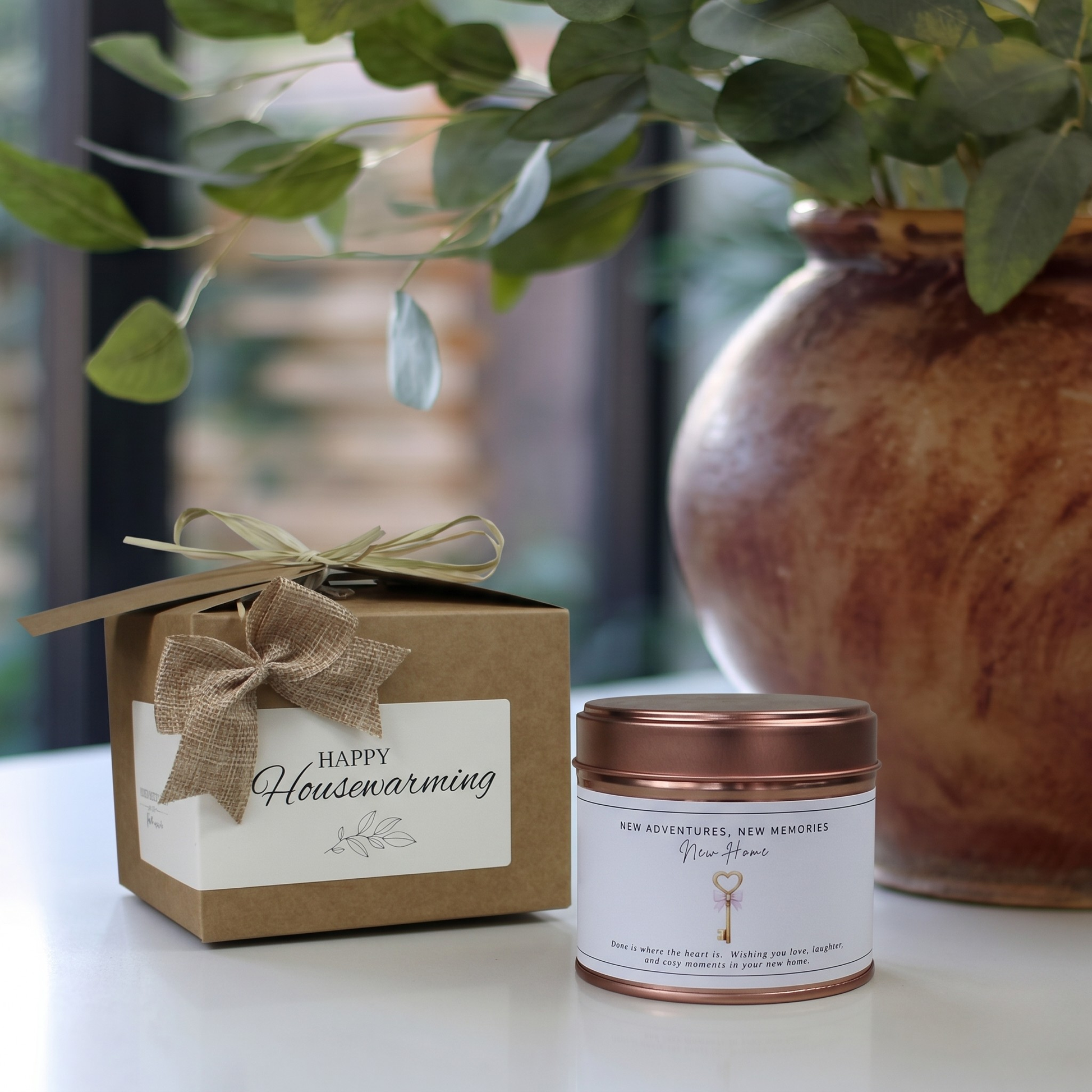 Custom housewarming care package gift box featuring a personalized first home adventure candle and matching home fragrance diffuser by Hideaway Home Fragrances.