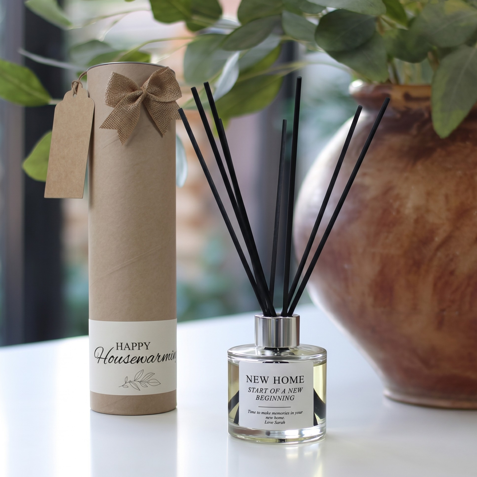 Personalised new home candle and luxury reed diffuser housewarming gift set, beautifully packaged and ready to gift by Hideaway Home Fragrances.