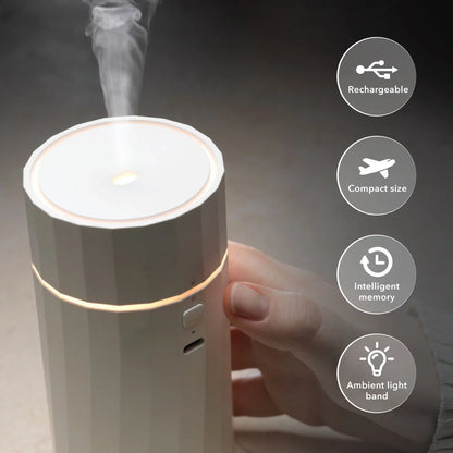 Hideaway Home Fragrances Nomad cordless aroma diffuser styled on a rustic wooden coffee table in a calm living room