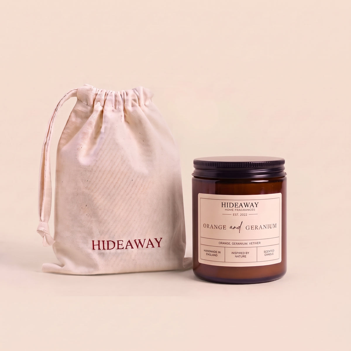 Invigorating orange and geranium aromatic candle in an amber glass jar creating a cheerful room mood from Hideaway Home Fragrances