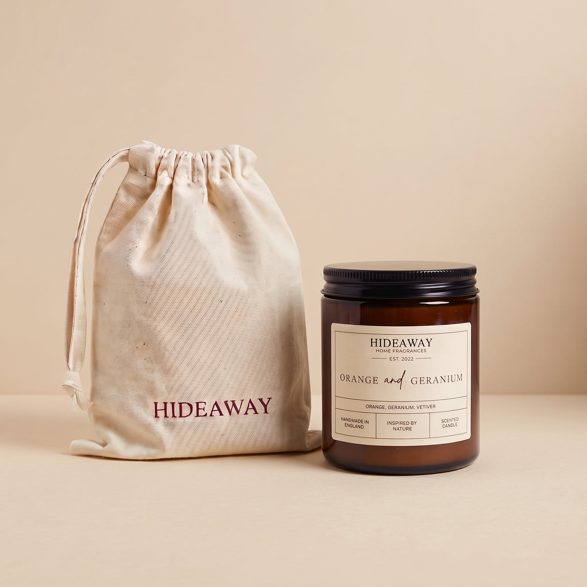 Invigorating orange and geranium aromatic candle in an amber glass jar creating a cheerful room mood from Hideaway Home Fragrances
