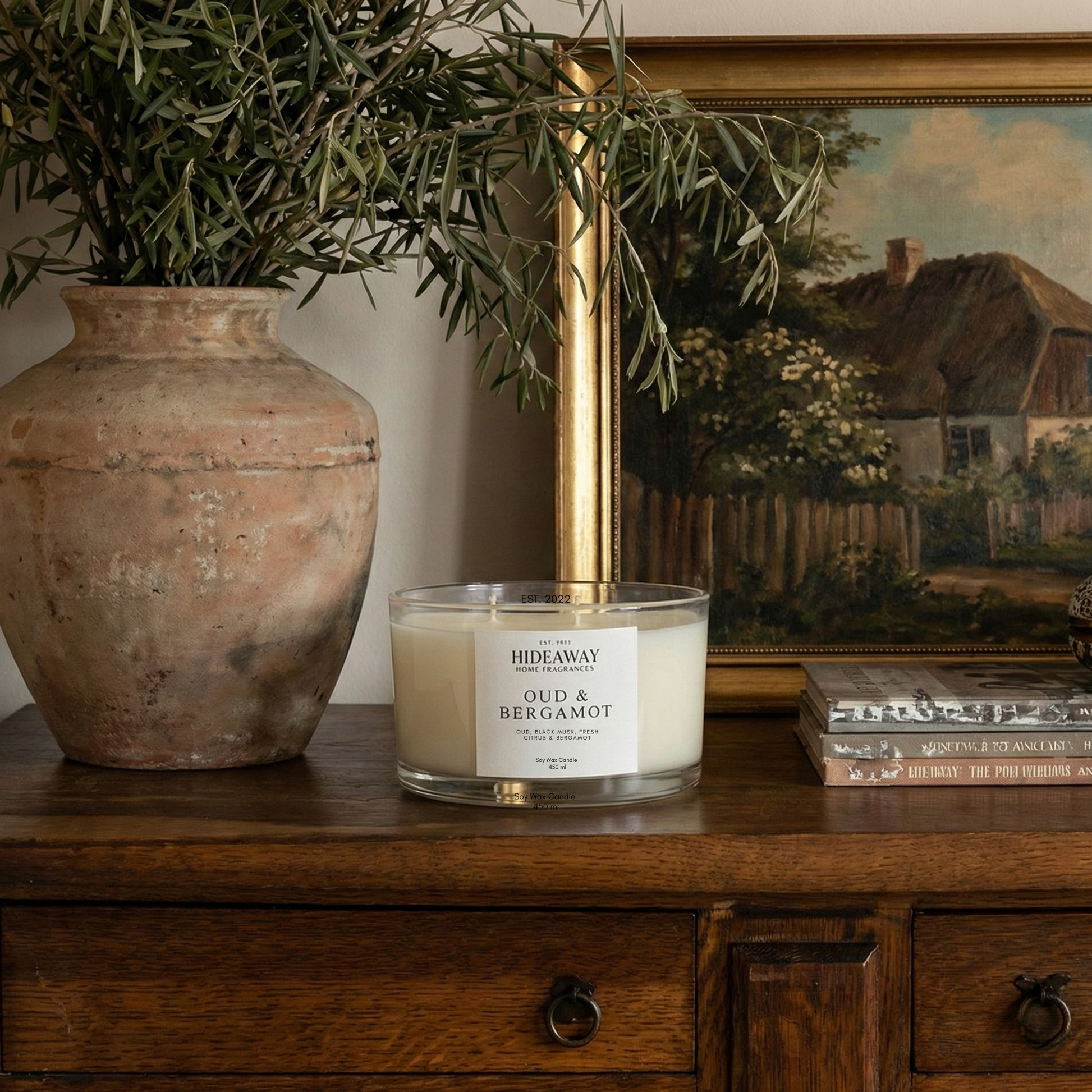 Sophisticated Oud & Bergamot three-wick candle filling a living space with rich smoky fragrance for refined home ambience