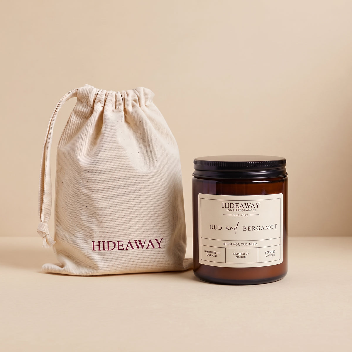 Sophisticated oud and bergamot aromatic candle in an amber glass jar creating a warm cosy atmosphere from Hideaway Home Fragrances