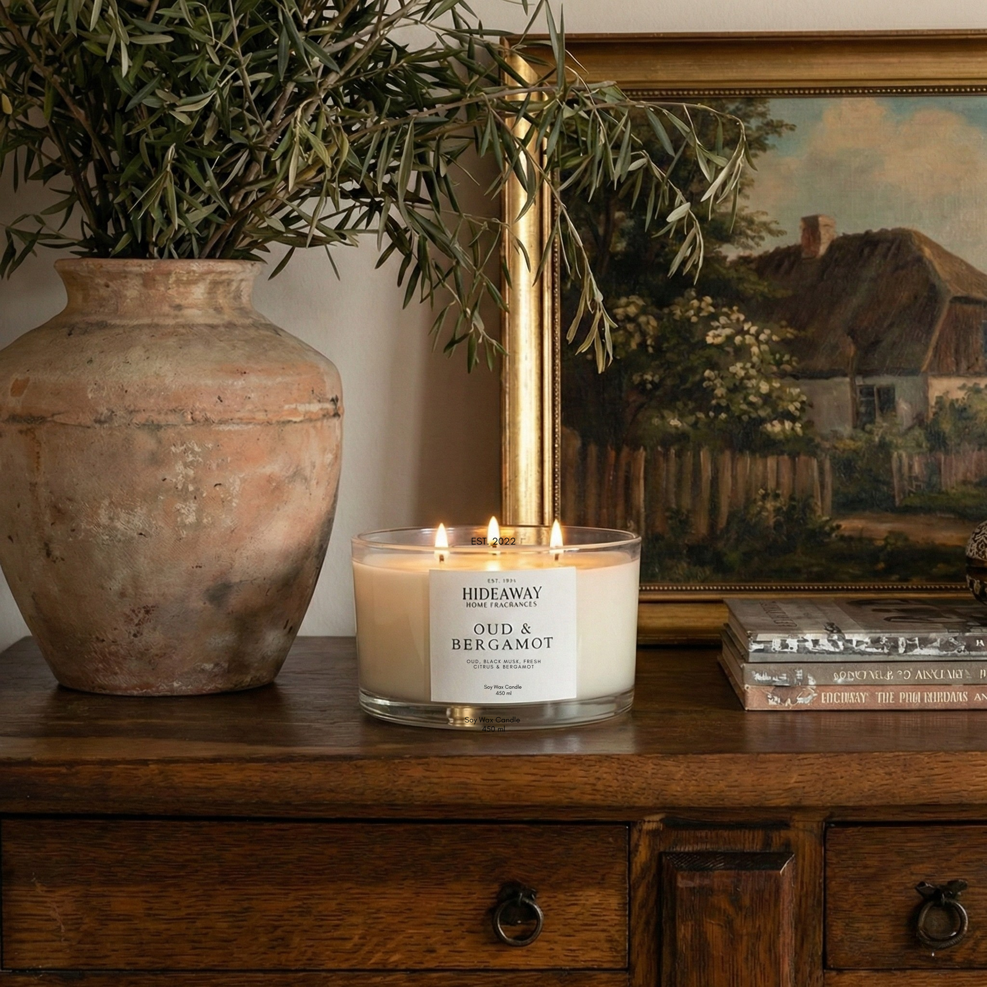 Oud and Bergamot 3-wick luxury candle with smoky, spiced aroma creating a warm and sophisticated evening atmosphere