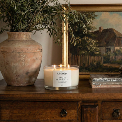 Oud and Bergamot 3-wick luxury candle with smoky, spiced aroma creating a warm and sophisticated evening atmosphere